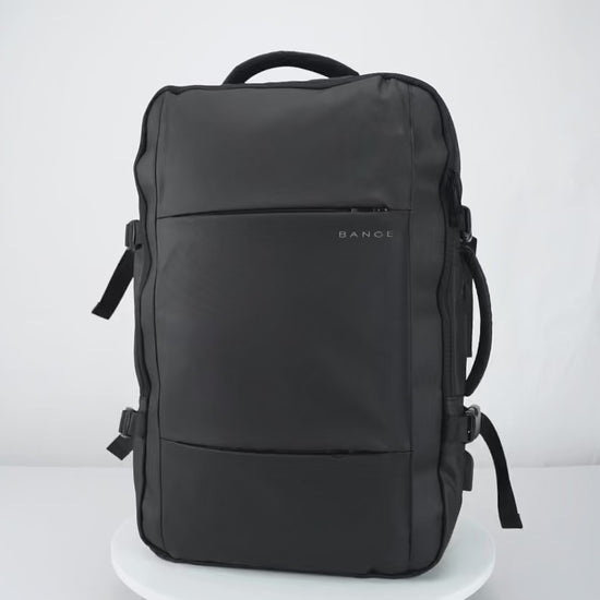 Video demonstration of the BANGE expandable travel backpack highlighting waterproof material, USB charging port, laptop compartment, anti-theft features, and ergonomic design for business and travel use.